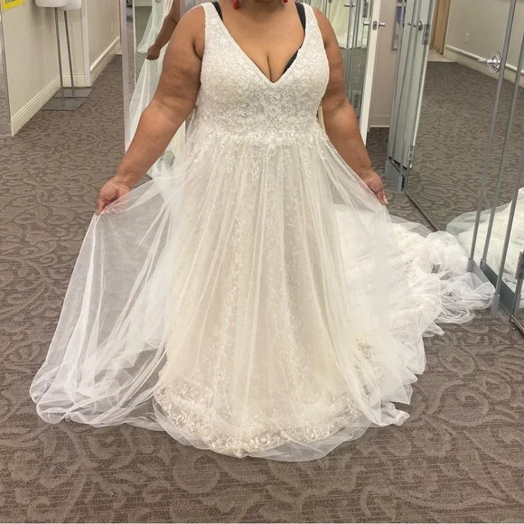 This wedding dress is a size 20. Brand New and had never been worn before.